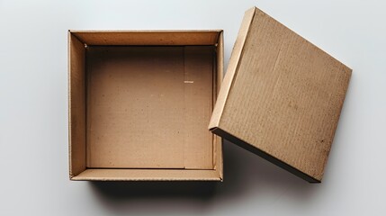 Fototapeta premium A flat, open cardboard box on white background. The closed lid is slightly opened to reveal the interior of an empty and clean box. powerful visual that conveys carefree vibes.