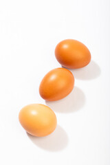Brown eggs on a white background