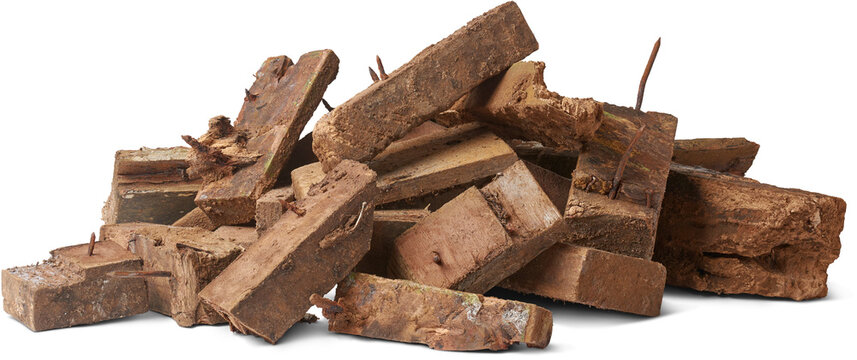 pile of scrape wood pieces with nails isolated white background, left over decayed or rotten weathered wood blocks from construction, unusable for recycling