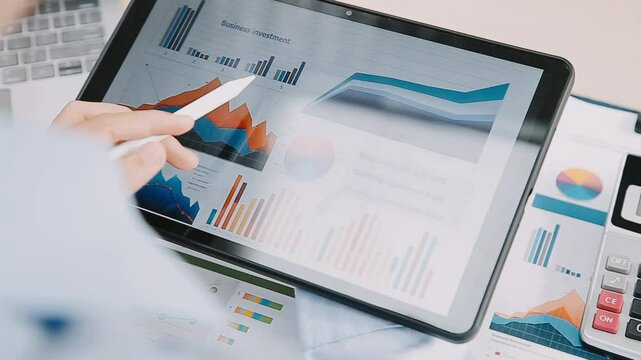 Young Business Asian woman using the tablet for doing math finance on wooden desk in office, analysis, seo, data, analyst, asian, financial, tax, accounting, Report financial document concept