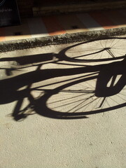 Bicycle shadow on paved road
