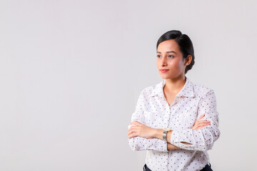 A Happy Business Woman Folding Her Hands And Looking Away