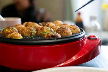 Home-made takoyaki with a takoyaki maker