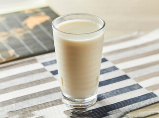 Frozen Soy Milk served in glass isolated on grey background side view of natural fresh drink