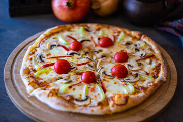 Vegetable pizza with bell pepper and cherry tomatoes