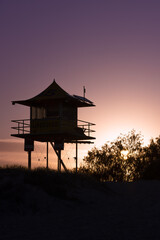 Lifeguard tower silhouetted against a purple sunset sky Gold Coast