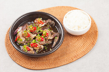  A food made by boiling ingredients such as onions and peppers, then pouring the cooled soy sauce over prepared crabs several times and allowing them to age.
