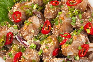  A food made by boiling ingredients such as onions and peppers, then pouring the cooled soy sauce over prepared crabs several times and allowing them to age.
