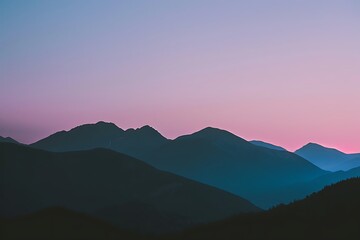 Obraz premium A minimalist mountain range silhouette against a twilight sky