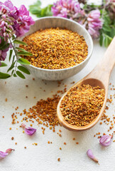 Healthy bee pollen grains.  Bee pollen on a bowl and acacia flowers.