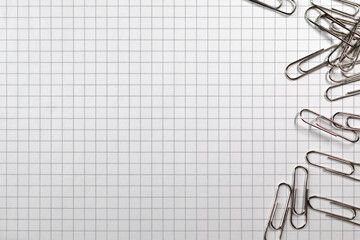 A sheet of paper clips. Cellular paper. Grid. Back to school