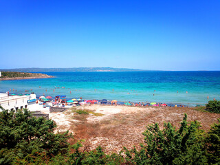 Obraz premium Beautiful sea in Sardinia, Italy. Blue, clear sea in Italy. Beautiful background with the sea. Beach view. South Sardinia.