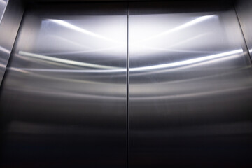 The image is of a silver elevator door