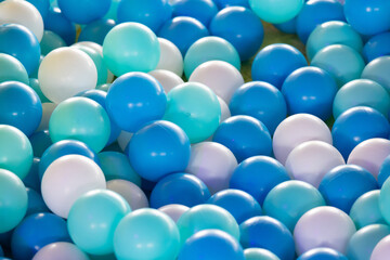 A pile of blue and white balls