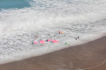 Itzurun beach in the city of Zumaia (Euskadi), in northern Spain, famous for its flysch. People learning to surf.
Long exposure photography technique.
