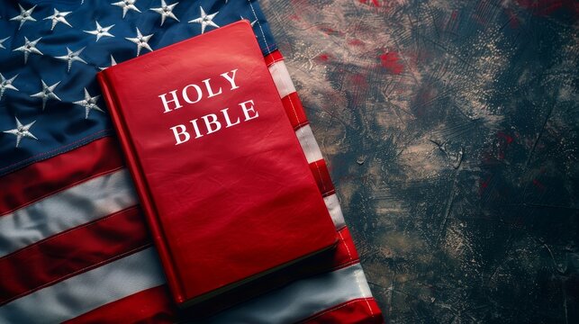 A red Bible is on top of a white American flag