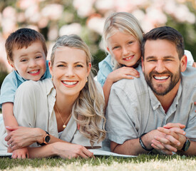 Portrait, family and grass for picnic, smile and outdoor to relax in summer, love and bonding in break. Parents, woman and man with children, happy and weekend for connecting with young kids in park
