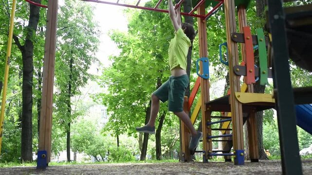 11 year old boy, Child playing climbing outdoor playground