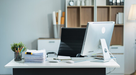 workspace area with laptop tablet smartphone and paperwork on the table in the office concept.
