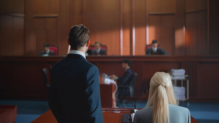 backside of lawyer speaking to attorney judgment in courtroom. legal and law concept