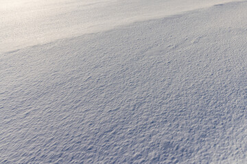 drifts of pure white snow after a snowfall