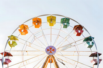 Ferris wheel against sky background.