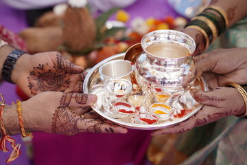 hand holding a silver gift in wedding