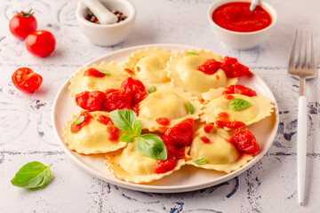 Ravioli with tomato sauce and basil