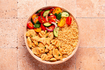Bowl of quinoa with vegan soy meat and vegetables.