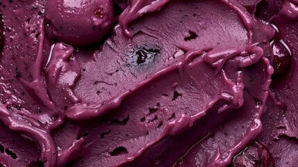 Obraz premium A dollop of smooth sorbet made with foraged chokeberries known for their deep purple color and tart almost citruslike flavor.