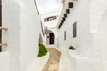 Menorca in Spain on the Balearic Islands, the quiet and picturesque village of Binibeca with white houses
