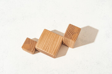 Product presenation mockup scene made with textured wooden shapes for your product placement. Studio photography.