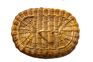 Fototapeta premium Seen from above, the texture of the serving hood or rice cover is made from oval-shaped woven rattan, which is a typical Indonesian craft product. isolated on white