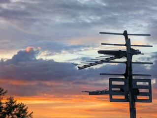 Terrestrial TV Arial Against a Cloudy Sky at sunset 