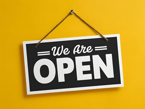 banner with a hanging we are open sign