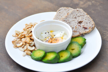 whole wheat bread or sourdough bread with nuts , avocado and soft boiled egg