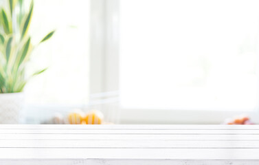 Wooden board and free space for decoration. Kitchen interier. Sunny natural light and window shade. Space for a mockup of your products.