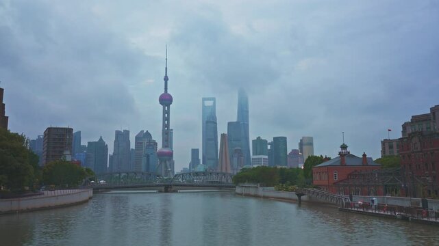 4K Timelapse - Uraban skyline and cityscape at sunrise on cloudy day in Shanghai China. footage of city skyline and modern buildings in Shanghai, China. Famous city landmarks in China.
