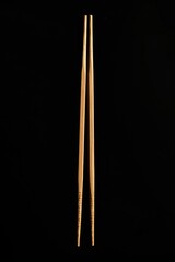 A pair of chopsticks sitting next to each other