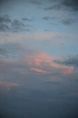 beautiful cloudy sunset creating pink and orange clouds.