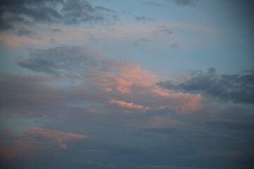 beautiful cloudy sunset creating pink and orange clouds.