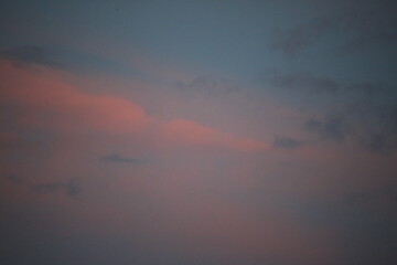 beautiful cloudy sunset creating pink and orange clouds.