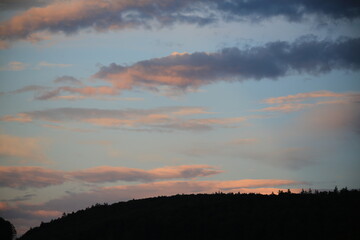beautiful cloudy sunset creating pink and orange clouds.