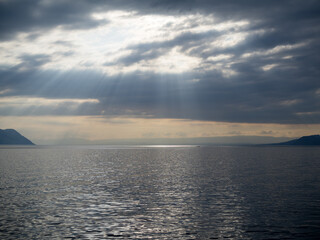 Sun rays between the clouds over Geneva lake
