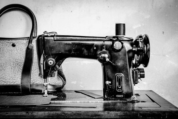 Vintage sewing machine in black and white color.