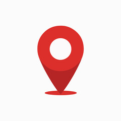 A red location pin icon. The pin is designed with a rounded top, resembling a location marker, and a pointed bottom, indicating direction. It is set against a white background