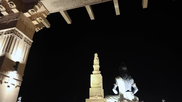 idols of hindu holy sage sitting in mediation at outdoor at night