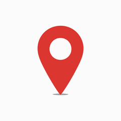 A red location pin icon. The pin is designed with a rounded top, resembling a location marker, and a pointed bottom, indicating direction. It is set against a white background, making the red color