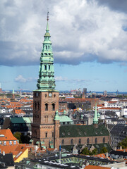 Obraz premium Church tower over Copenhagen roofs