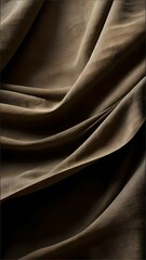 Obraz premium A piece of fabric with a brown color and a wrinkled texture